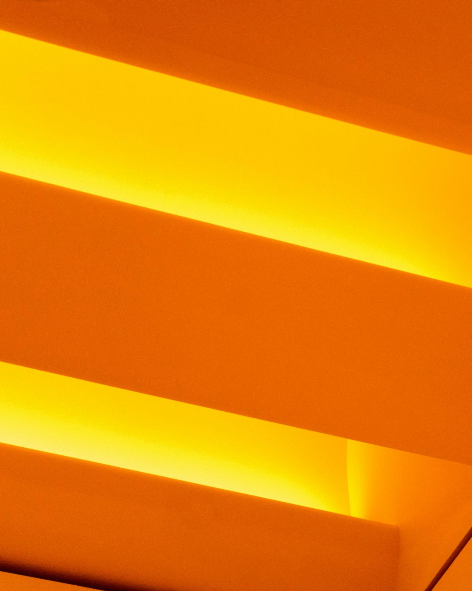 Stepped architecture washed in orange light